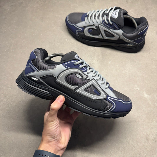B30 trainer sneaker with white laces, black/blue panels, chunky dark sole