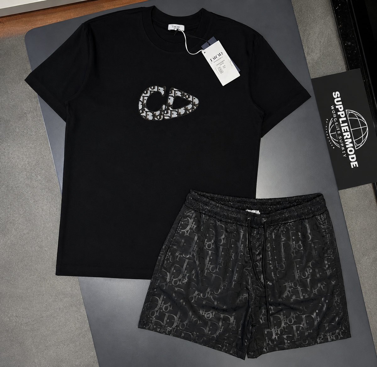 Black T-shirt and shorts set with graphic logo print and patterned drawstring shorts