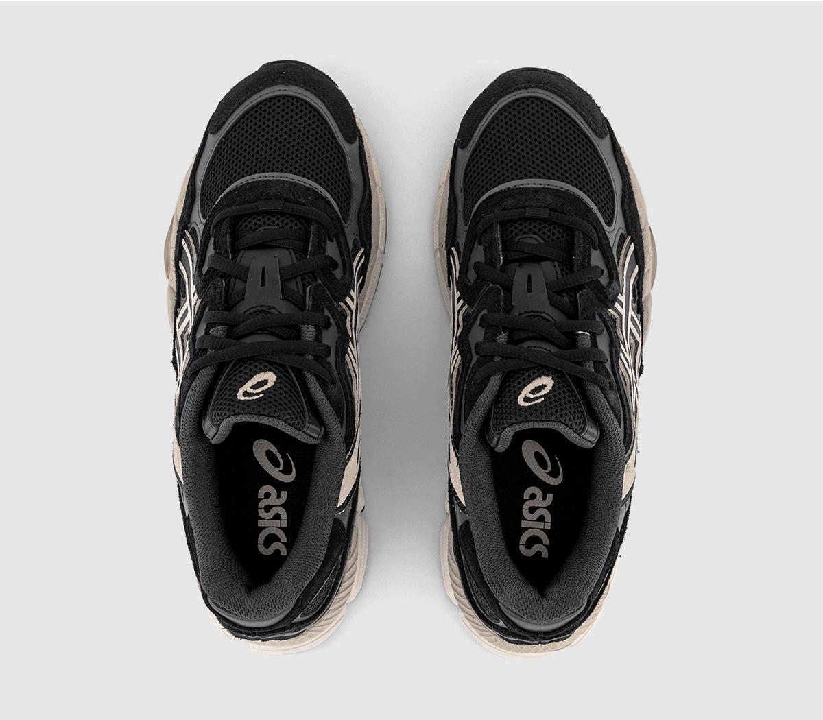 Pair top view: black lace-up sneakers with cream trim and Asics tongue branding