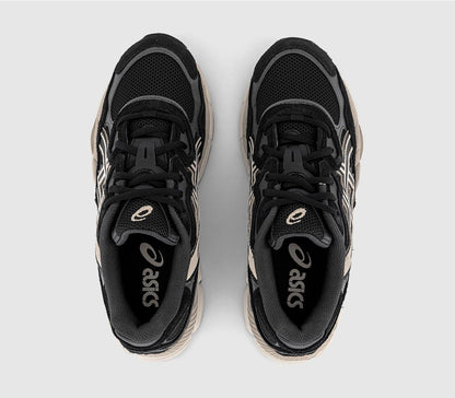 Pair top view: black lace-up sneakers with cream trim and Asics tongue branding