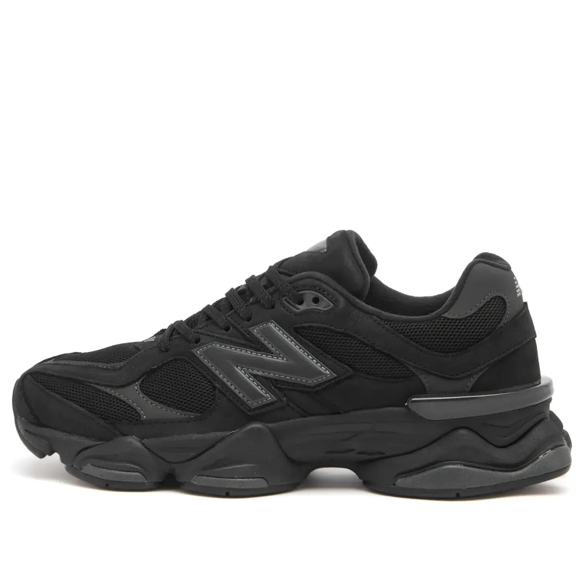 New Balance 9060 in black and grey, side view with textured mesh upper