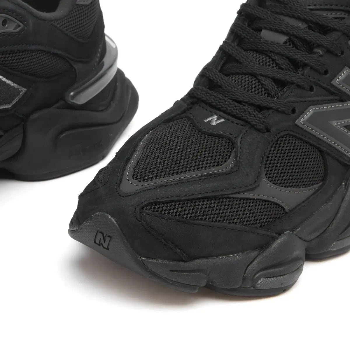 NB 9060 toe and lace area, black upper with grey N logo panels