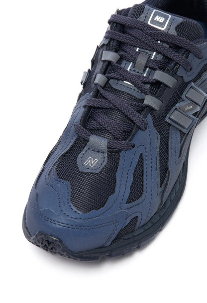 NB Eclipse Navy shoe upper close-up with laces, logo patch, and mesh panels