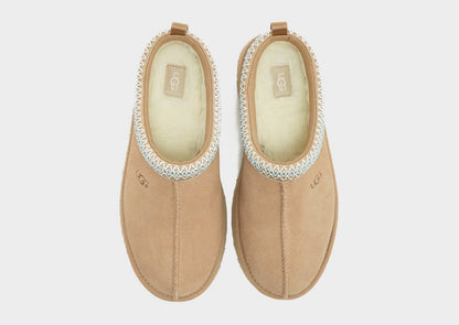 Pair of sand UG Tazz suede slippers with padded cream lining and light blue trim