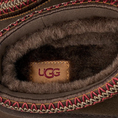 UG Dusted Cocoa interior view with UGG logo, faux-fur lining and red knit edge trim