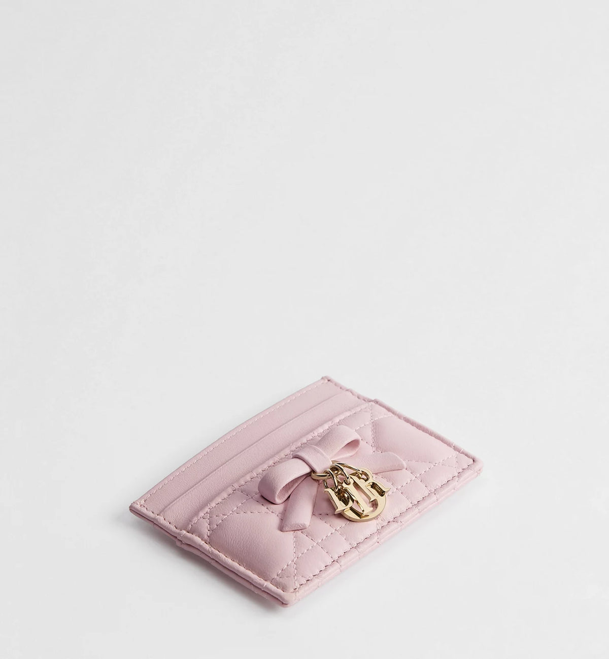 Pink quilted card holder, open slot view with bow and gold logo clasp
