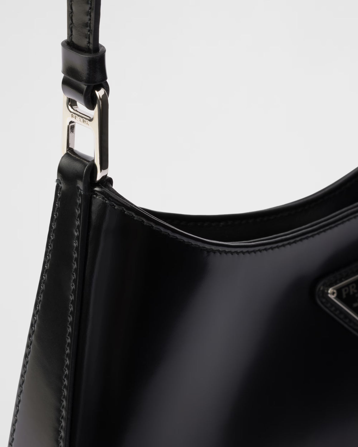 Prada Cleo shoulder bag strap hardware and stitched black leather edge