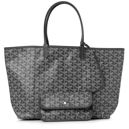 Gray tote bag with repeating pattern, black handles, and front flap with snap