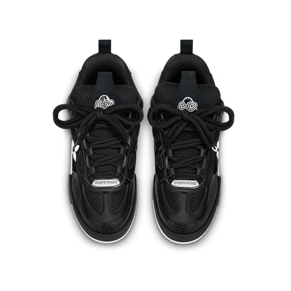 Pair of black LVE skate trainers, front lace-up, mesh panels and white edging