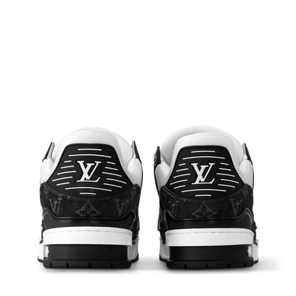 LVE trainer heel view, black logo patch and white midsoles with tread