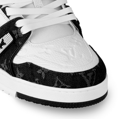LVE trainer close-up, white leather toe with black patterned side and laces
