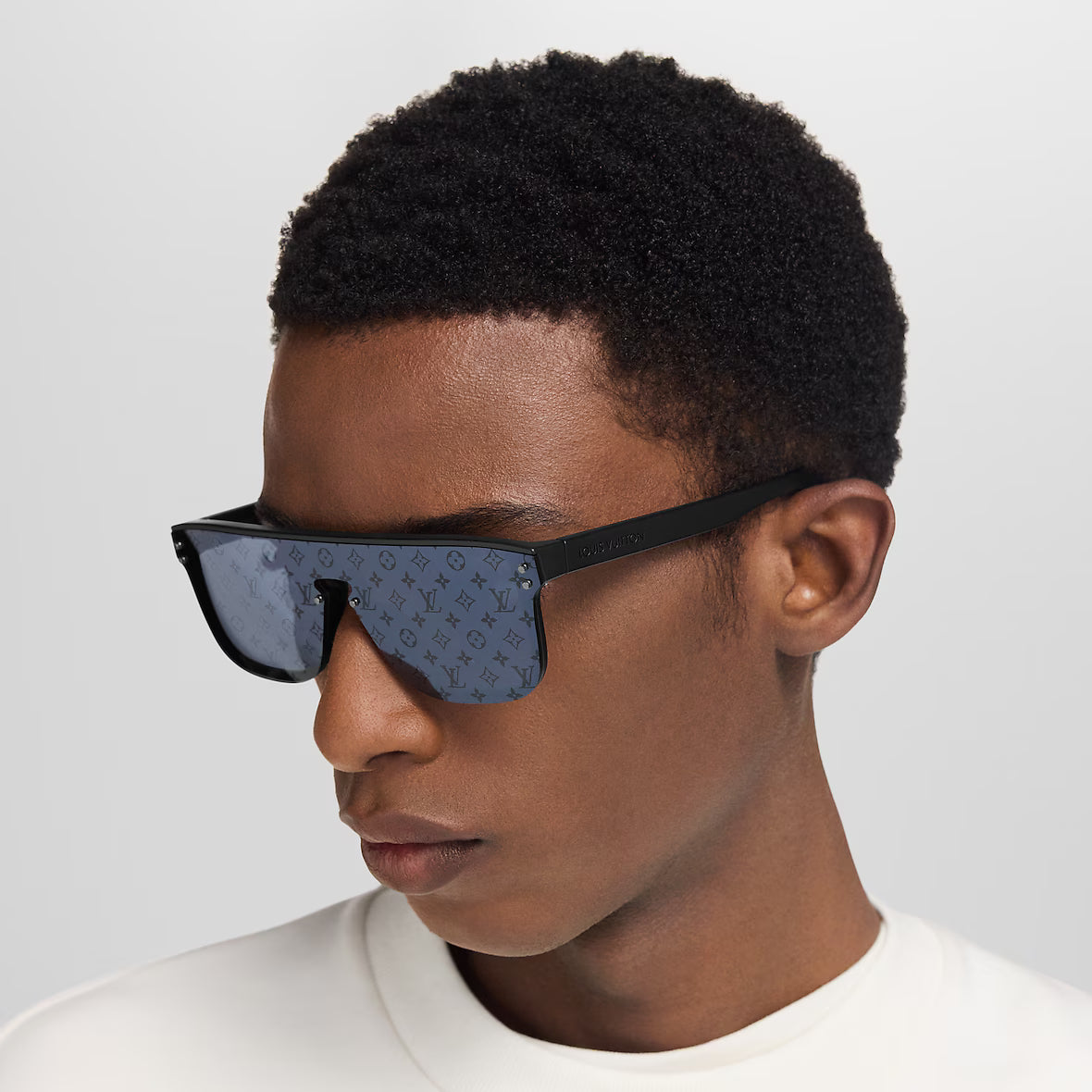 Waimea sunglasses side profile on model with dark blue patterned lens