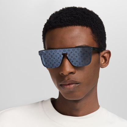 Waimea sunglasses on model: dark blue patterned lenses with black arms