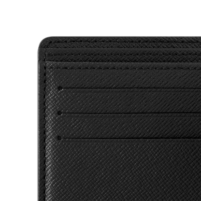 Black wallet close-up of card slots and stitched edge, textured leather