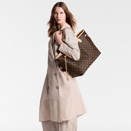 Neverfull GM tote on shoulder view, monogram canvas with tan leather straps and trim