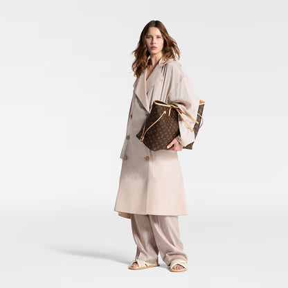 Louis Vuitton Neverfull GM tote held at side, monogram canvas with tan leather trim