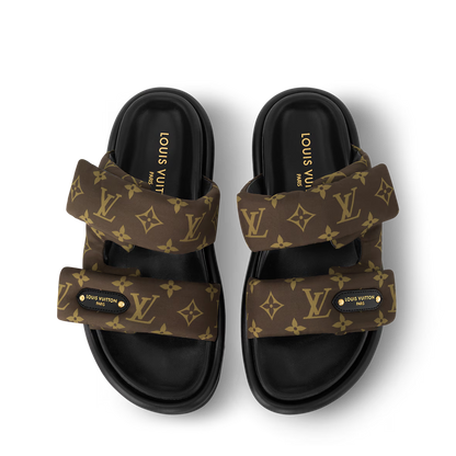 Pool Pillow Flat Comfort Mules pair, padded straps with monogram-style emblem details