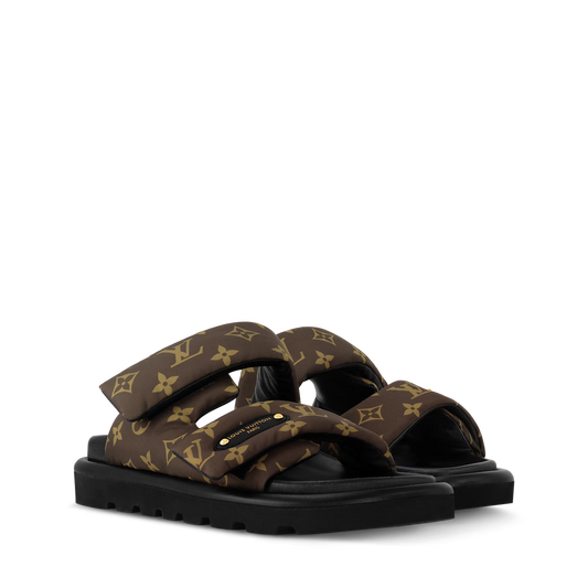 Pool Pillow Flat Comfort Mules with brown and black monogram-style floral pattern