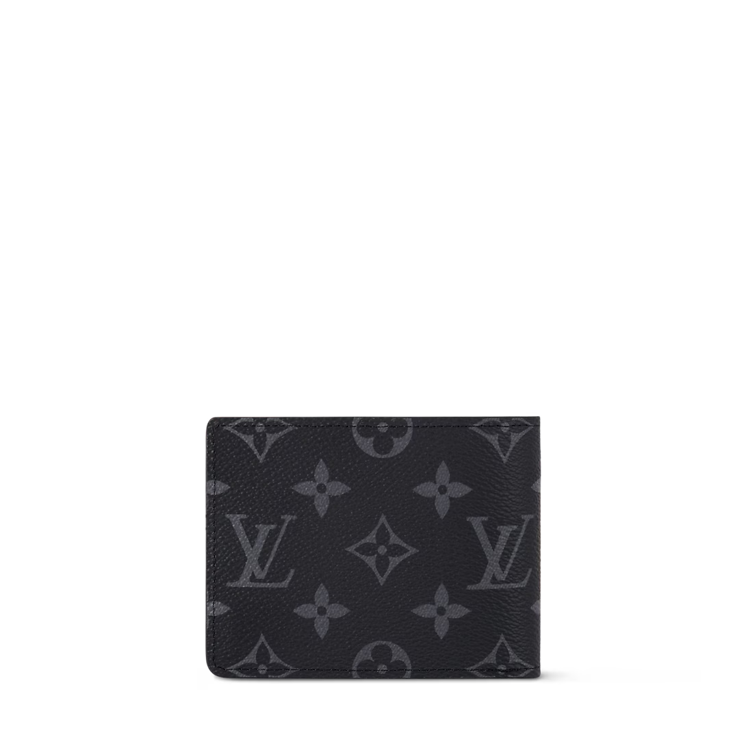Monogram Eclipse Reverse slender wallet front view with embossed monogram pattern
