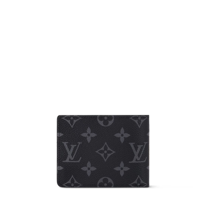 Monogram Eclipse Reverse slender wallet front view with embossed monogram pattern