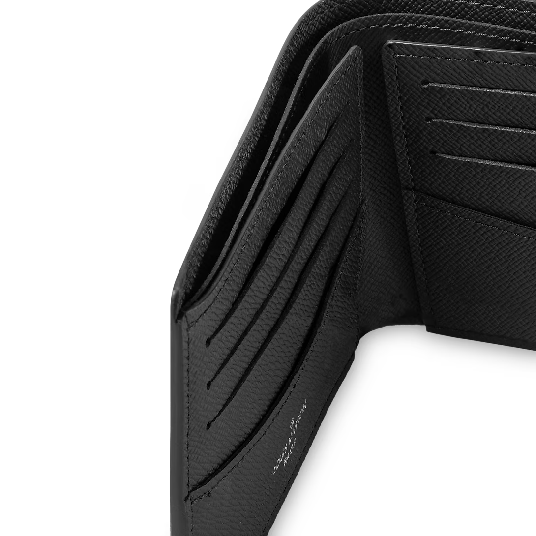 Slender wallet in Monogram Eclipse Reverse with card slots visible inside