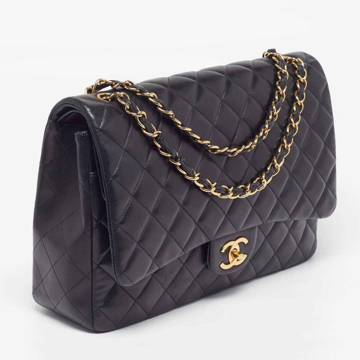 Side view of Maxi Classic Flap shoulder bag with gold chain and curved flap detail