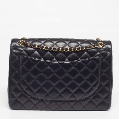 Black maxi flap bag with diamond quilting, curved front, gold chain shoulder strap