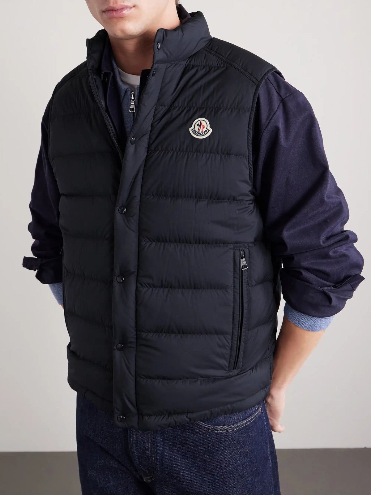 Barthe down gilet front close-up with stand collar, snap buttons, logo patch